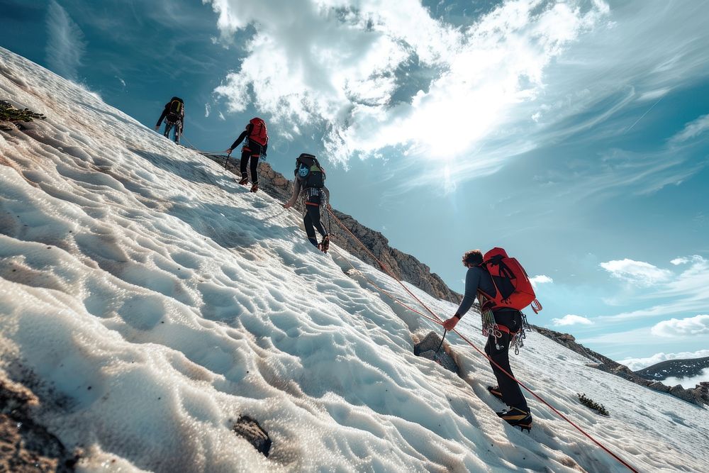 Tied climbers climbing mountain outdoors snow recreation.