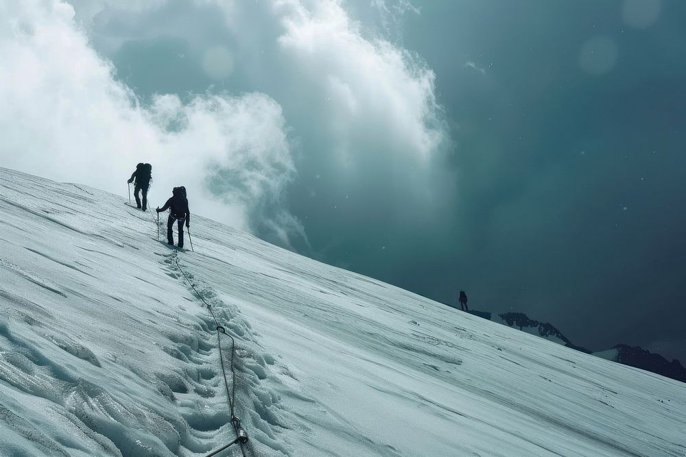 Tied climbers climbing mountain outdoors snow recreation.
