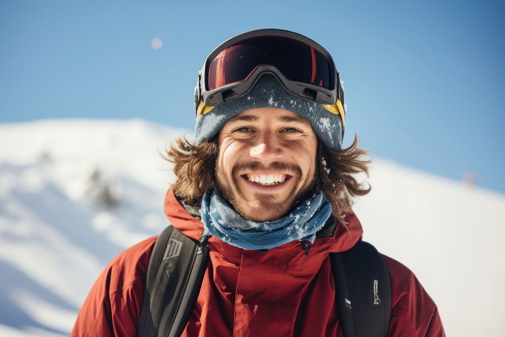 Snowboarder smiling mountain portrait outdoors.