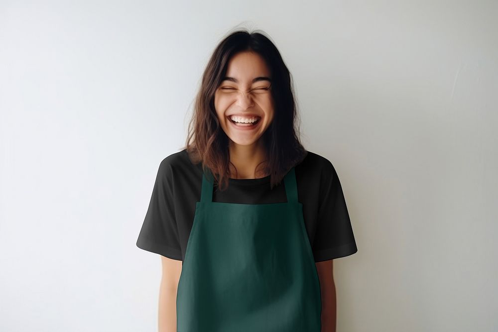 Happy woman in green apron