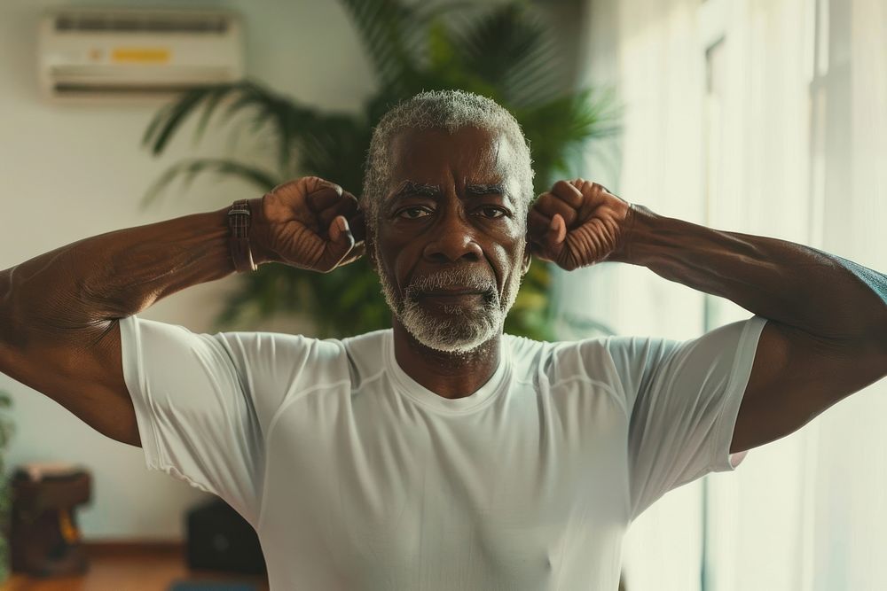 Senior african american man shoulder sweating clothing.