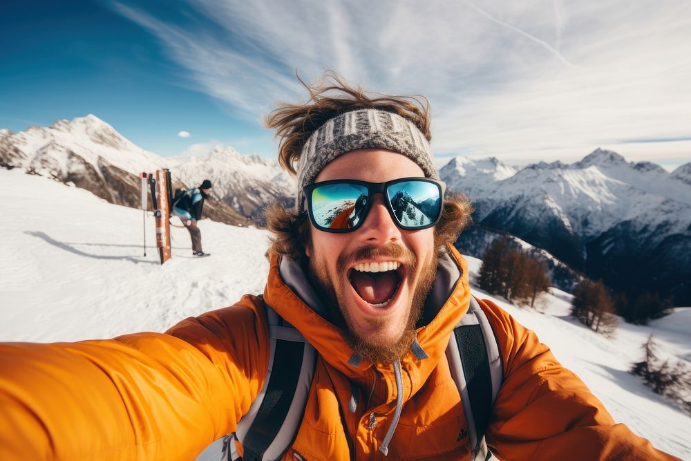 Snowboarder mountain selfie recreation.