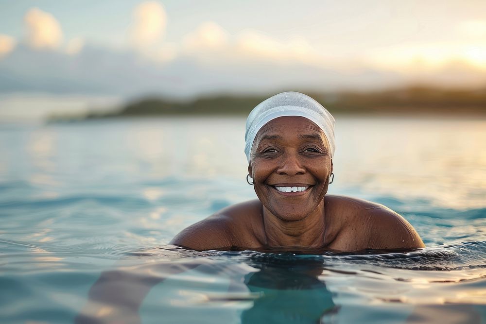 Black senior woman swimmer happy recreation swimming.