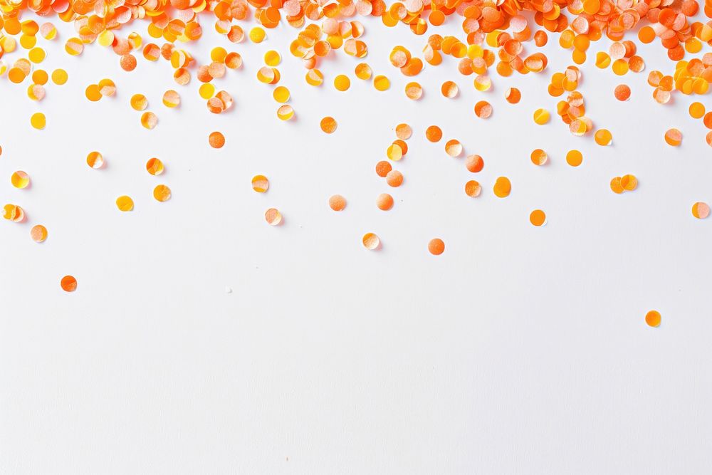 Tiny orange confetti border produce paper food.