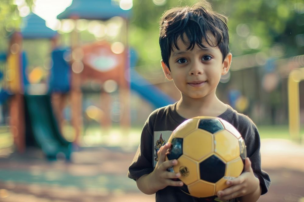 Kid holding soccer photo photography football.
