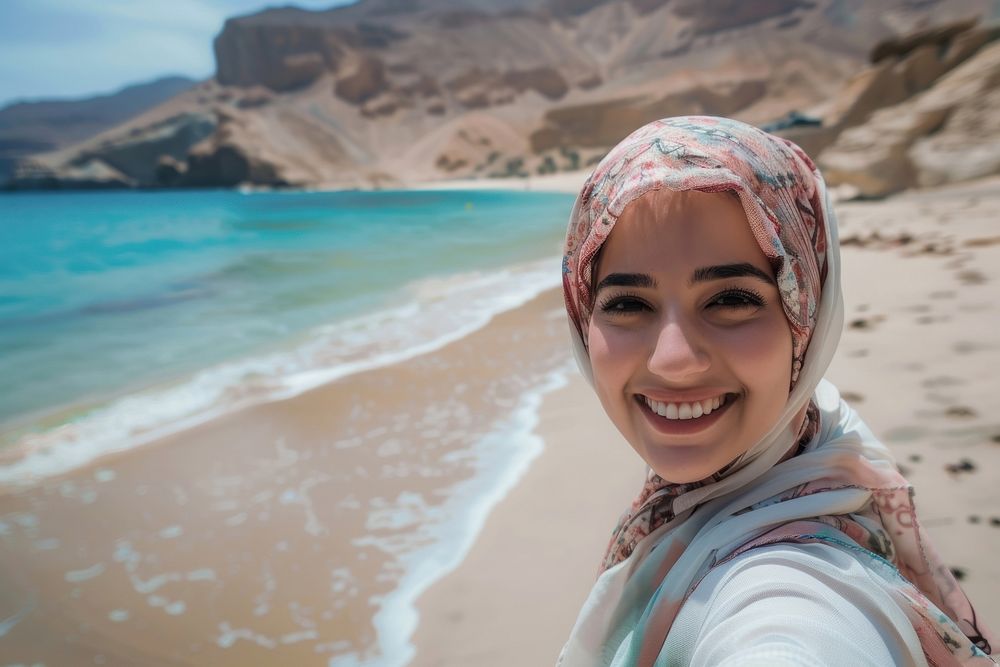 Middle eastern woman selfie photo beach.