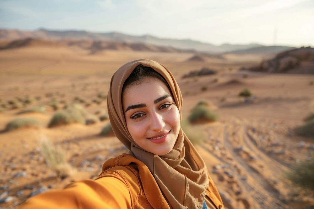 Middle eastern woman desert selfie photo.