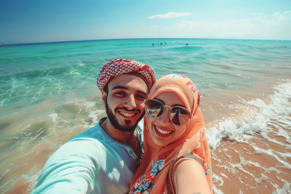 Middle eastern couple selfie photo beach.