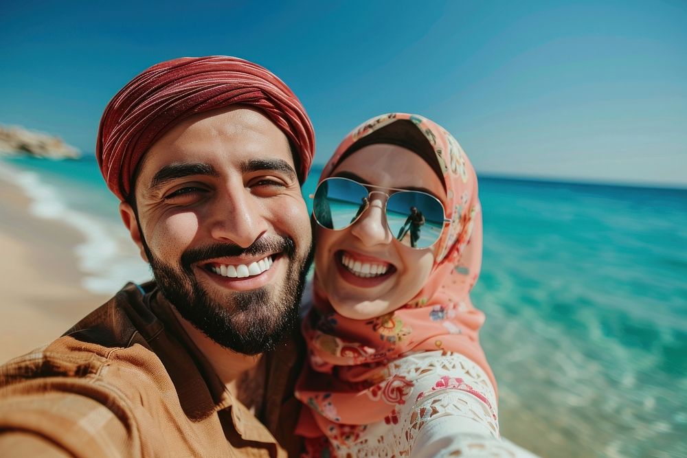 Middle eastern couple selfie clothing laughing.