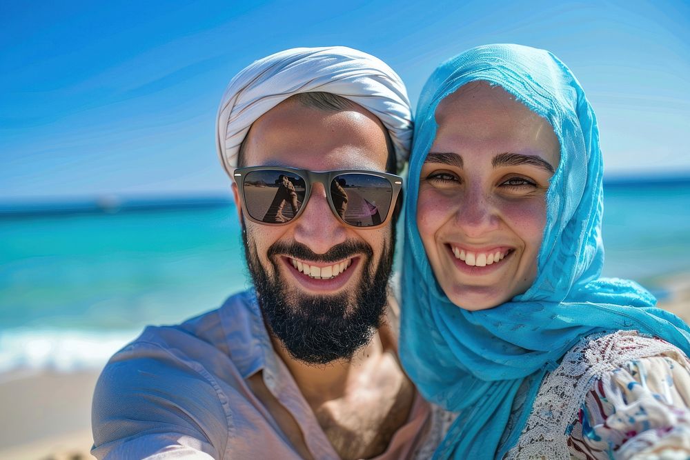 Middle eastern couple selfie accessories sunglasses.