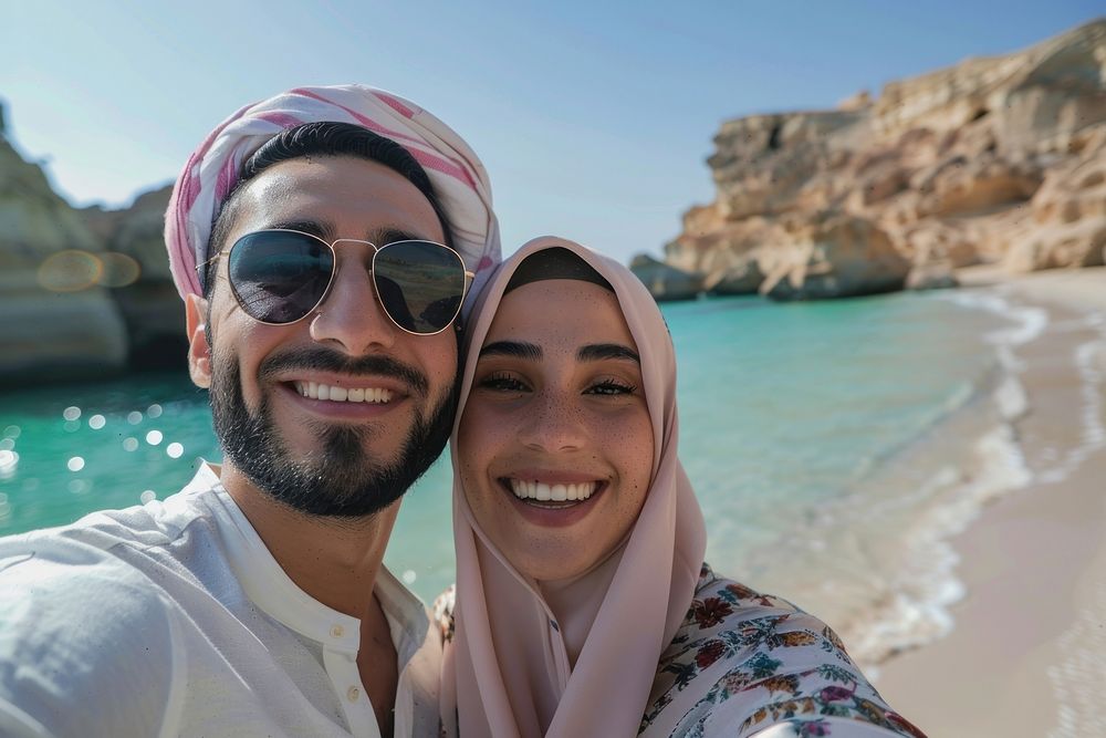 Middle eastern couple selfie beach photo.