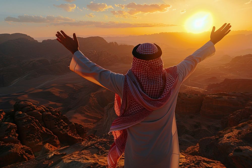 Middle eastern man triumphant outdoors person.