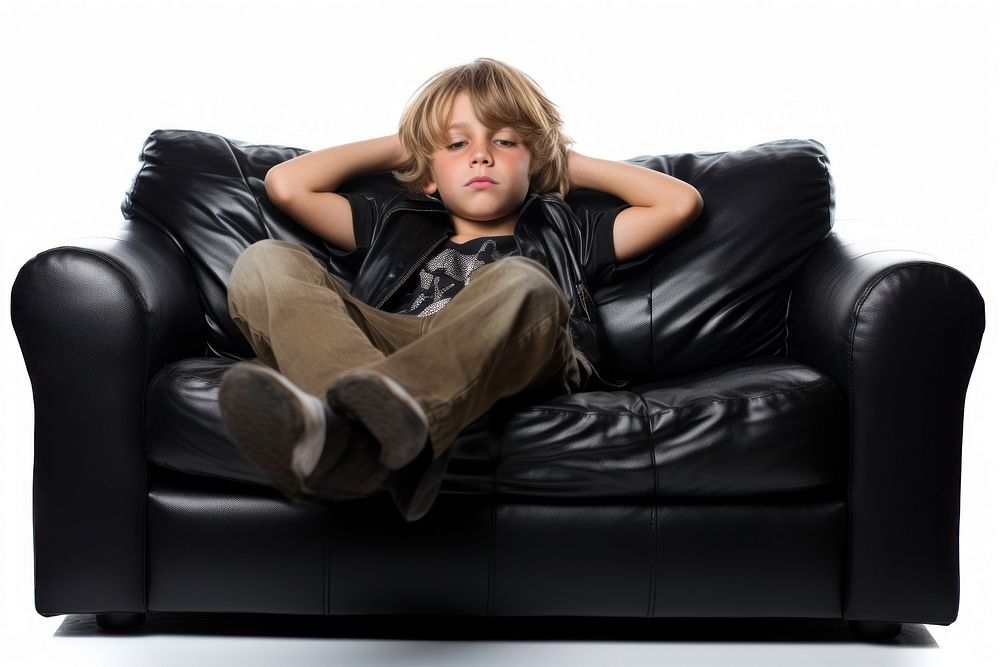 Kid watching TV furniture clothing armchair.