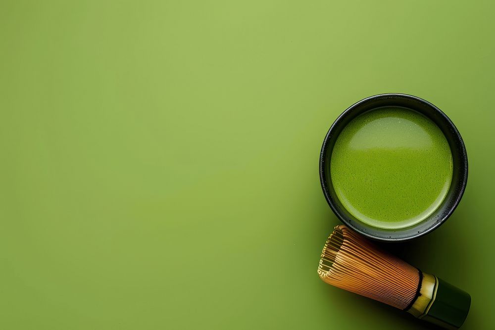 Cup of matcha with whisk cosmetics beverage perfume.