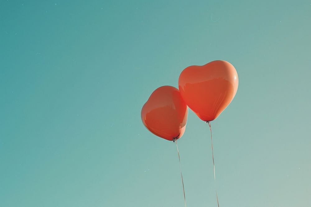 Minimal space heart shaped balloons symbol love heart symbol.