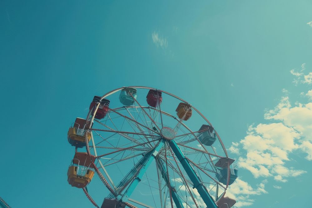 Minimal space of clear blue sky amusement park machine wheel.