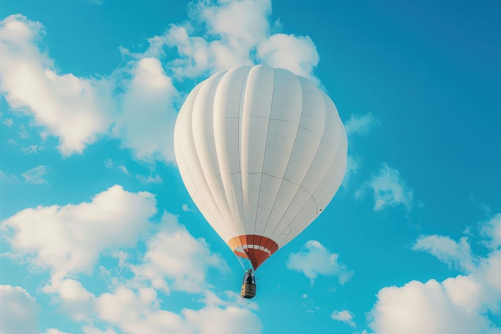 A white hot air balloon transportation aircraft vehicle.