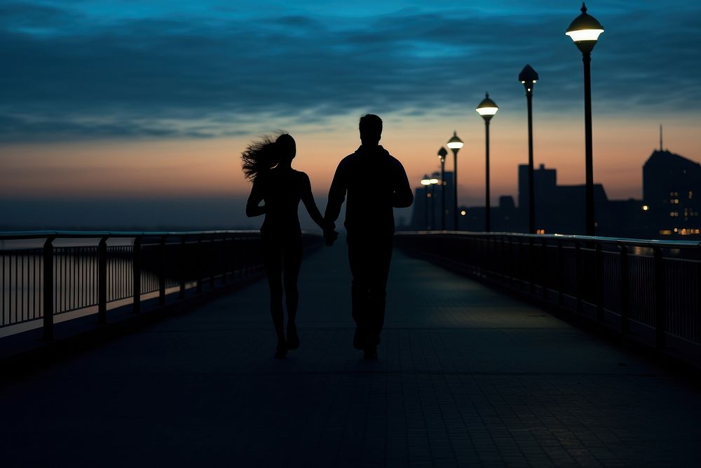 Couple running silhouette photography sunset adult togetherness.