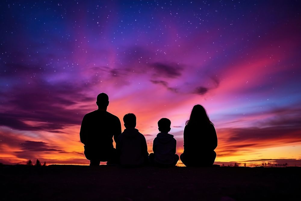 Family sitting silhouette photography sky outdoors sunset.