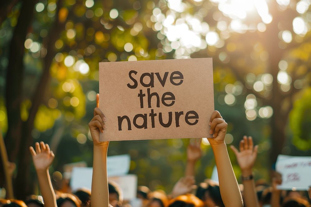 Environmentalist holding save the nature sign