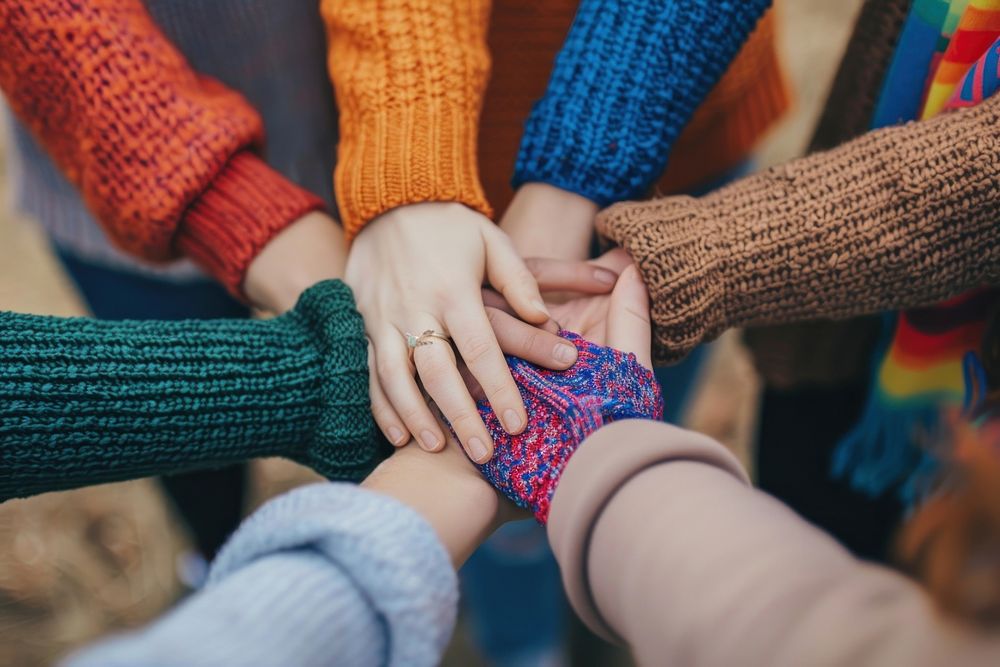 Group of friends holding hands clothing knitwear apparel.