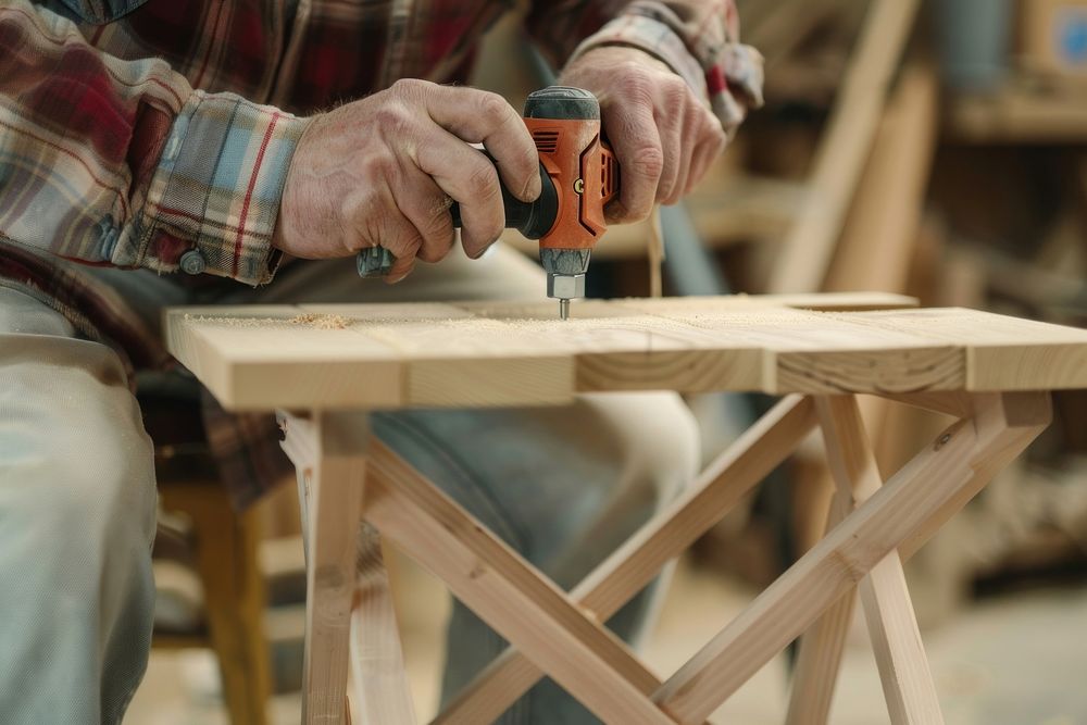 Man constructing a wooden chair adult drill craftsperson.