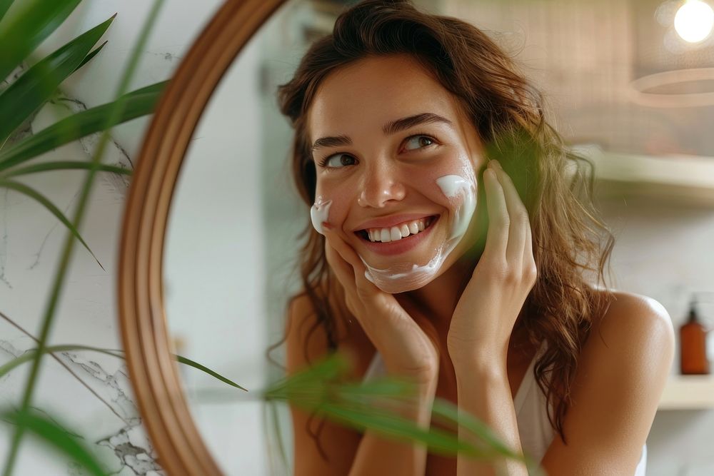 Smiling girl look in mirror smiling adult smile.