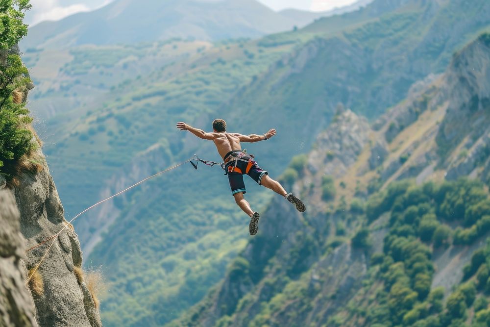 Man in bungee jumping recreation adventure mountain.