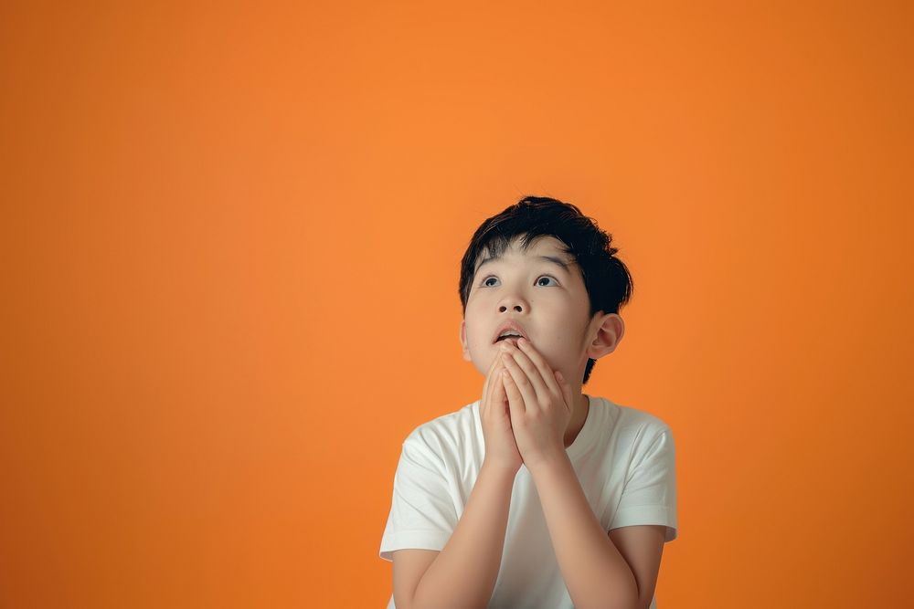 Asian boy looking upwards surprised | Premium Photo - rawpixel