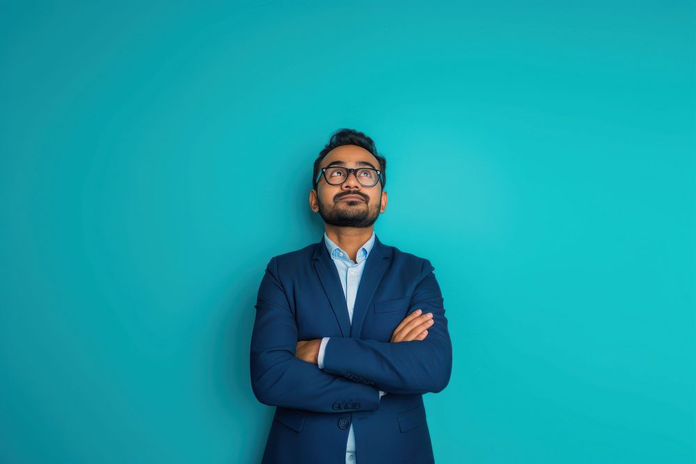 Indian businessman looking upwards surprised person human.