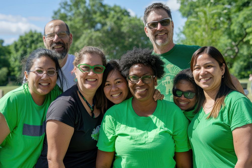 Volunteers in green shirt photo park accessories.