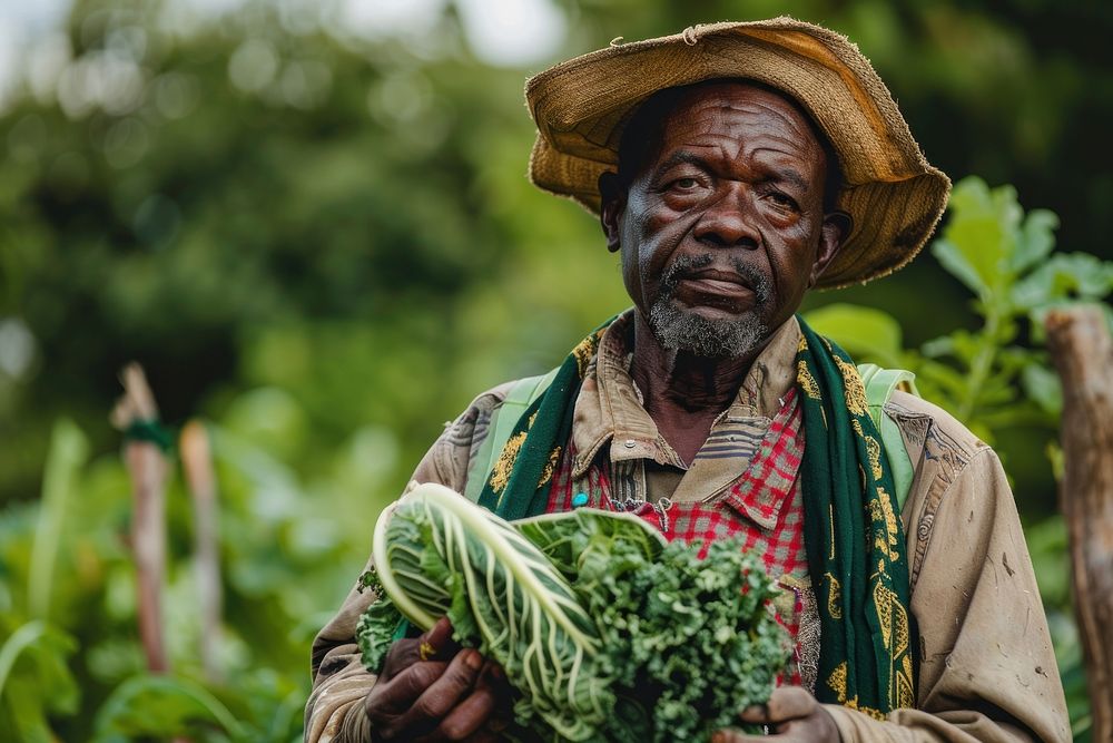 Black South African man farmers vegetable produce person.