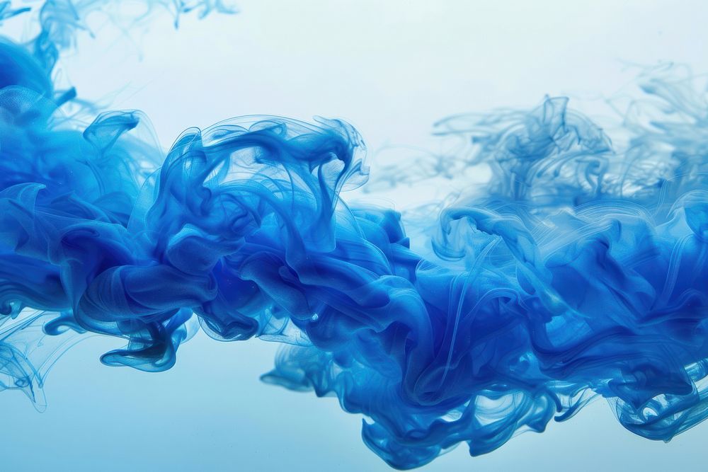 Blue ink wave flowing underwater smoke blue backgrounds.