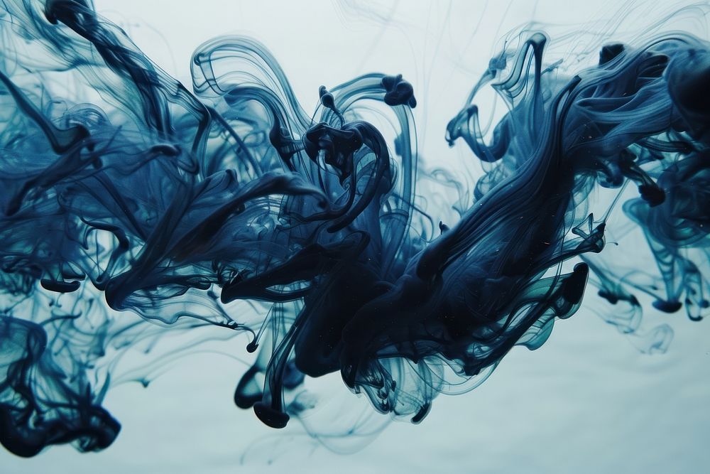 Blue ink underwater blue backgrounds splashing.