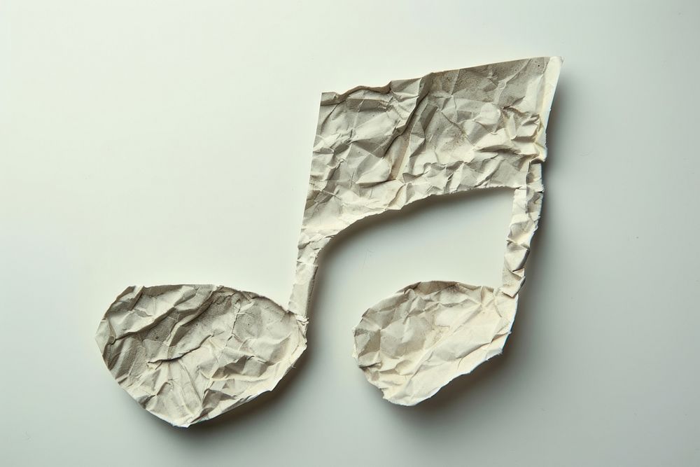 Musical note in style of crumpled paper aluminium diaper.