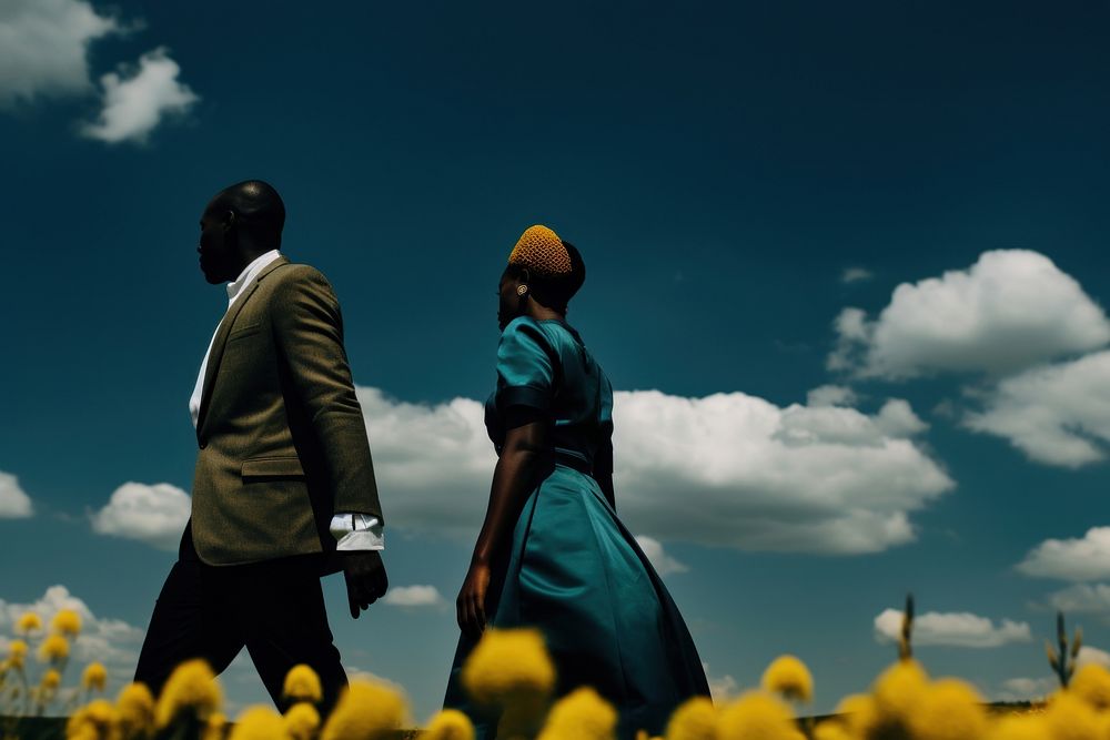 Photo of a African Wedding clothing outdoors walking.