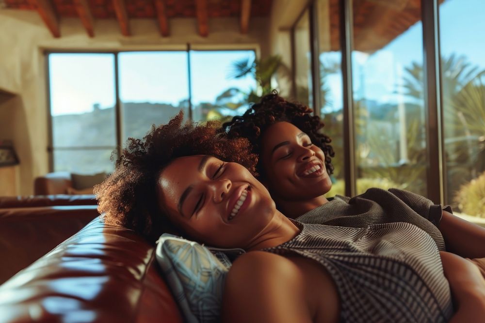 Black South African woman romantic laughing cuddling.