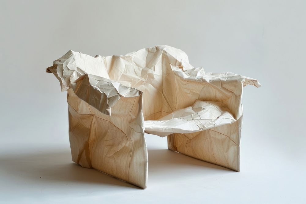 Furniture in style of crumpled paper origami chair.