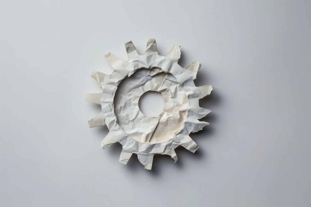 Gear in style of crumpled paper machine art.