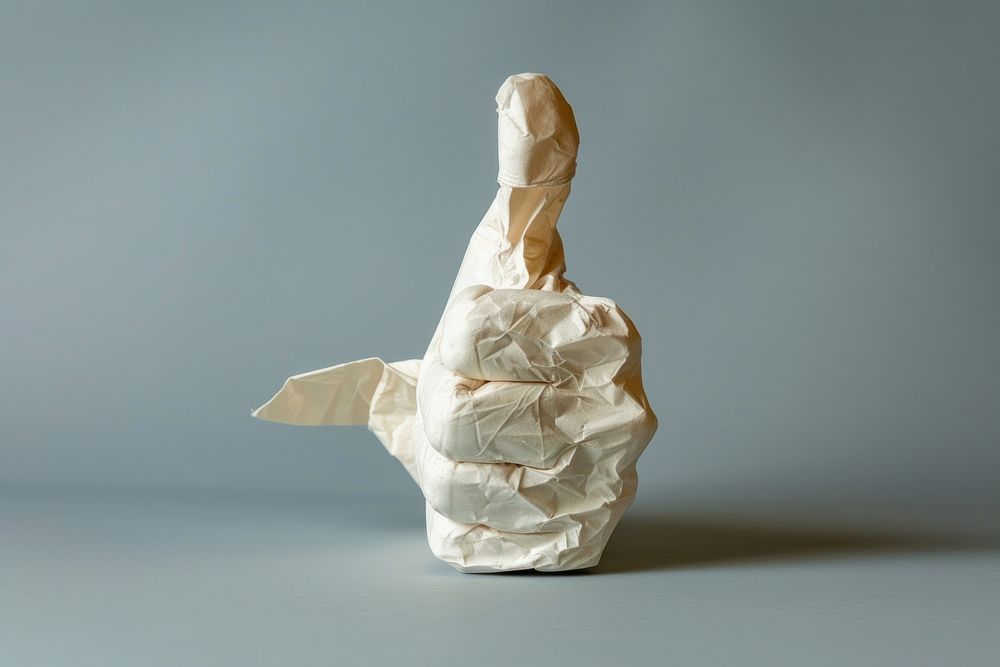 Thumbs up in style of crumpled paper origami person.