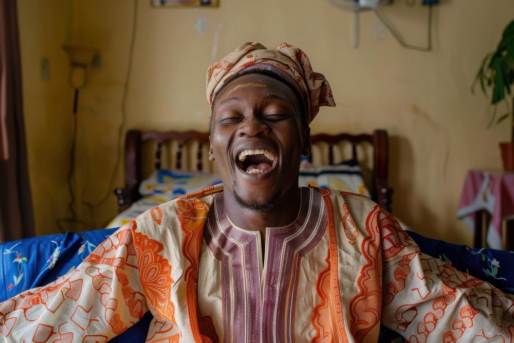 Nigerian man clothing laughing apparel.