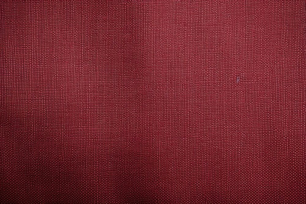 Top view photo of a canvas texture maroon velvet.