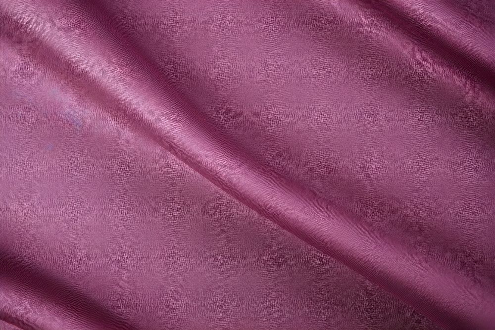 Top view photo of a plain fabric texture velvet purple silk.