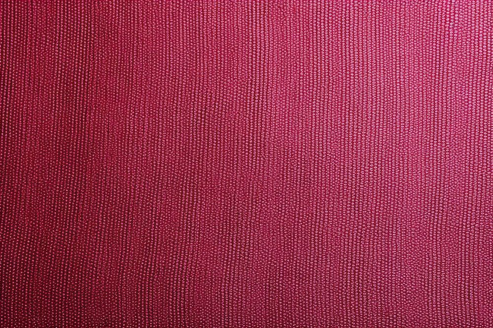 Top view photo of a plain fabric texture maroon linen home decor.
