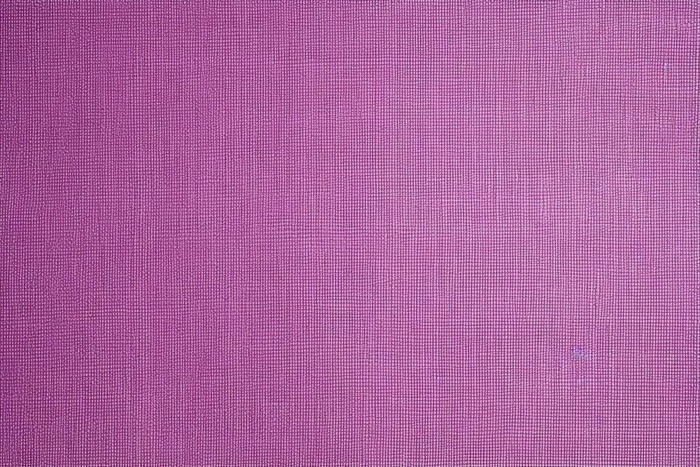 Top view photo of a plain fabric texture purple velvet linen.