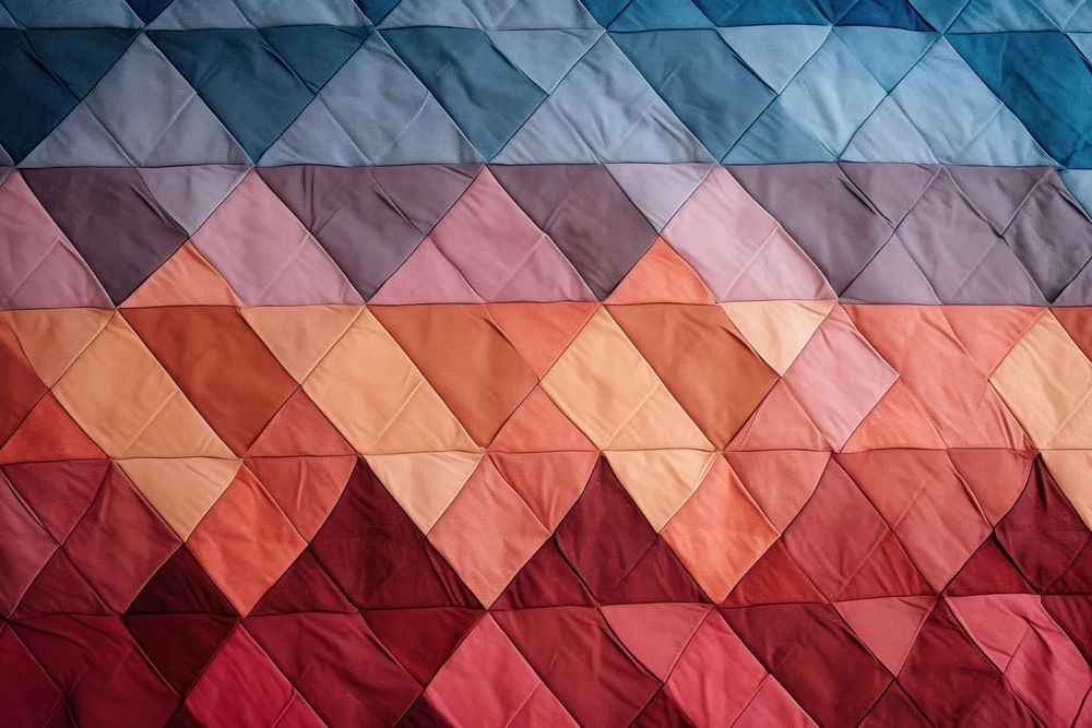 Top view photo of a quilt pattern texture patchwork blanket.