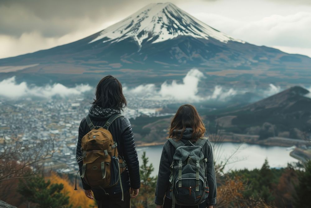 Happy japanese couple hiking backpacking recreation.