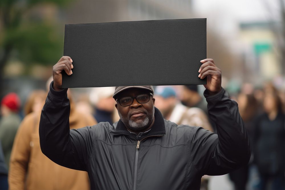 Man holding blank sign