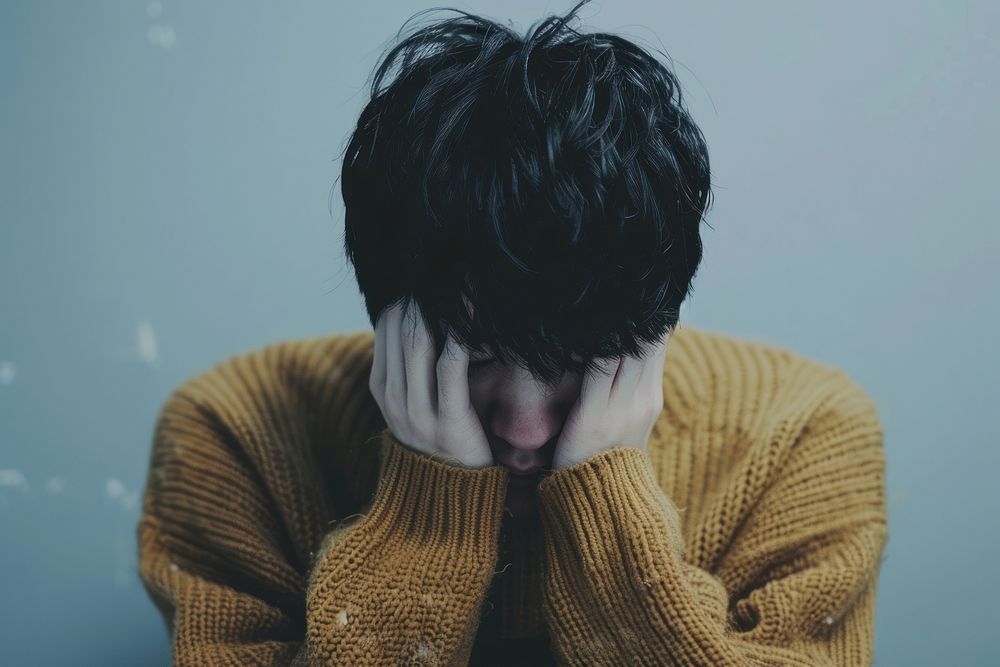 Depressed korean man head clothing knitwear.