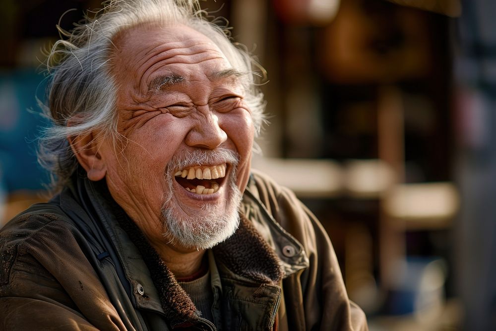 Japanese man laughing person happy.